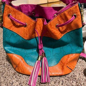 Color-block textured leather drawstring bucket bag with tassels by Aldo